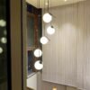 S1b839daf95d24b1bb298b7f8ae66e6f0F Lustre bola vidro escada