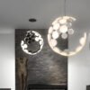 Lumin-ria-pendente-de-designer-italiano-lumin-ria-criativa-de-lua-branca-preta-suspens-o-quarto-1 Lustre pós-moderno italiano