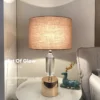 abajur_moderno_de_luxo_cristal_k9_transparente_e_cupula_redonda_tecido_cabeceira_cama_quarto_do_casal_e_criado_mudo_de_sala_marca_miresa Abajur Mesa Cristal K9 Translúcido