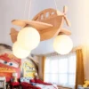 Luminária Infantil Avião De Madeira, uma opção de luminária de madeira infantil avião, vendida pela Miresa, loja-de-luminárias-São-Paulo.
