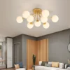 COCO-Bola-de-vidro-branco-Luzes-de-teto-lustre-moderno-preto-e-dourado-corpo-da-l-1 Luminária Sobrepor Bolas Vidro Brancas