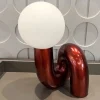 kf-S47b9cba5919f4fa3bb4d26bc8226f8ebN-Nordic-postmodern-model-desk-lamp-hotel-children-s-room-bedroom-living-room-minimalist-creative-glass-lamp Abajur Art Pop Tubo Em Curva Com Bola Branca Leitosa