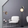 kf-S48b46ba291b64c2e93e7e0fff8a1c5f64-Nordic-Art-Creative-Personality-Post-Modern-Simple-and-Light-Luxury-Floor-Lamp-Bedroom-Living-Room-Sofa Luminária De Chão Preto Disco Post-Moderno