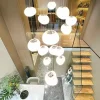 kf-S3a6bf45e2fc544eebcaf79d0a4ba98e4I-Nordic-home-decoration-stair-chandelier-living-room-and-dining-room-Pendant-lights-ceiling-light-indoor-lighting Lustre Grande Para Escadas Forma Pedra De Acrílico Branca
