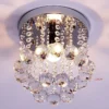 kf-HTB1Zc8mPFXXXXbvXpXXq6xXFXXX3-Lustre-de-cristal-ilumina-o-superior-k9-de-cristal-de-a-o-inoxid-vel-moldura-luminaria Luminária Sobrepor Redonda Aço Inoxidável e Pingentes de Cristais K9