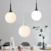kf-Sf2ab9ab8fb20456b8b126b0724c3a2f71-Lumin-ria-pendente-moderna-com-bola-de-vidro-lumin-ria-pendente-de-loft-com-luz-led Pendente Bola Branca Leitosa Gota